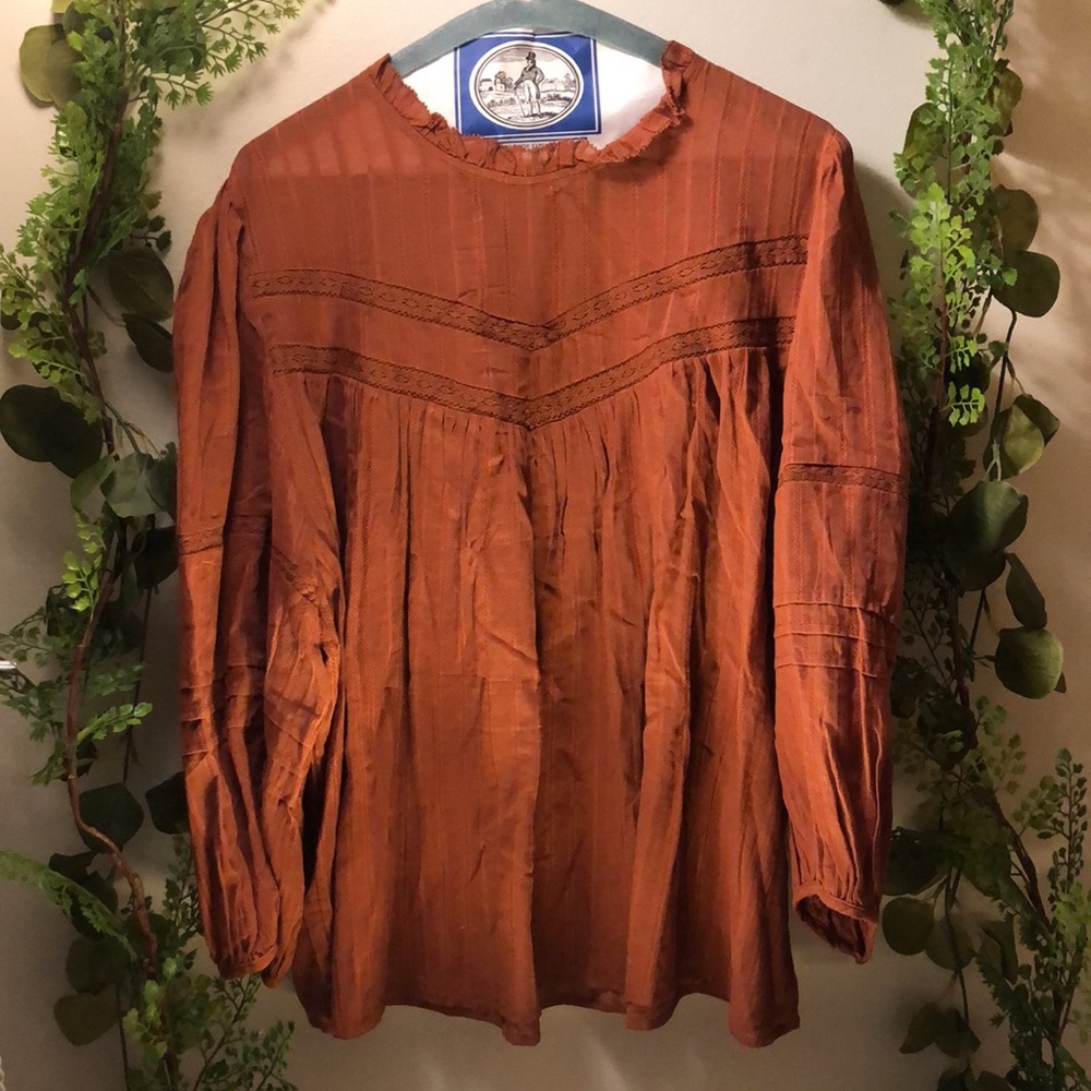 burnt orange flowy blouse